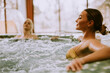 © BGStock72 - Young women relaxing in the whirlpool bathtub at the poolside