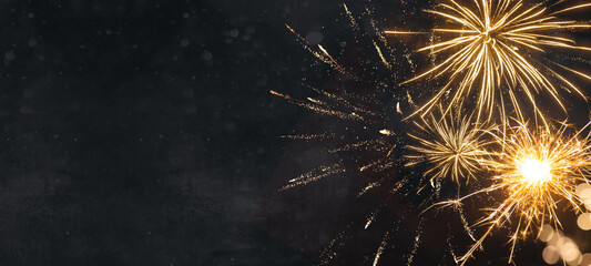 Silvester New Year 2025, New Year's Eve background banner panorama long- firework and sparklers on dark black night texture, with space for text