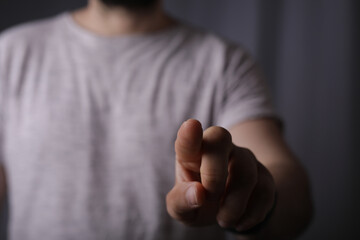 Poster - young man finger pointing touch