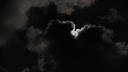 Wall Mural - full moon moving between clouds, 4k
