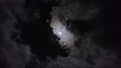 Wall Mural - full moon moving between clouds, 4k