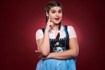 Wall Mural - Woman in traditional costume on red background