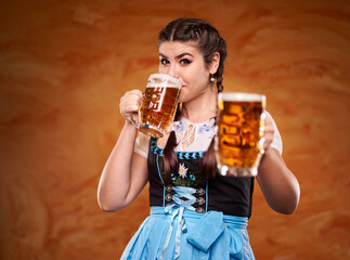 Wall Mural - German girl drinking beer