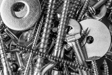 Mixed screws and nails. Industrial background. Home improvement.bolts and nuts.Close-up of various screws. Use for background, top view.