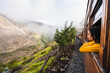 © KIKE ARNAIZ/Stocksy - Girl looking out the window on the train