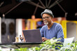 © Santi Nunez/Stocksy - Senior black man using his laptop.