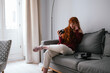 © KIKE ARNAIZ/Stocksy - ginger woman at home