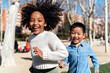 © Santi Nunez/Stocksy - Multiethnic children playing at the park.