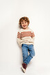 © Santi Nunez/Stocksy - Caucasian kid in studio smiling.