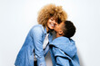 © Santi Nunez/Stocksy - Black Boy In Studio Kissing His Mom.