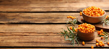 Fresh Ripe Sea Buckthorn On Wooden Table, Space For Text. Banner Design