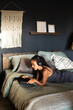© KIKE ARNAIZ/Stocksy - African american young adult using tablet