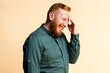 © Santi Nunez/Stocksy - Portrait of Redhead Man Laughing