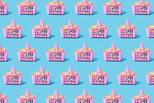 Pattern Of Pink Shopping Baskets Filled With Clothing