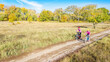 © Iuliia Sokolovska - Family on bikes autumn cycling outdoors, active mother and kid on bicycles, aerial view of happy family with child in fall park from above, sport and fitness concept