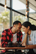 © Jacob Lund - Loving couple at a coffee shop together