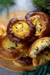 Traditional Russian baking pastry vatrushka, round buns, curd tart selective focus, closeup. Cheesecake with cottage cheese. Rustic food Photography.