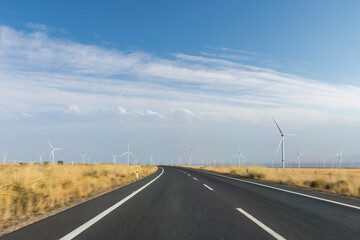 curve road motion blur through the wind farm