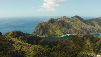 Bay and the tropical islands. Seascape with tropical rocky islands, ocean blue wate, aerial view. islands and mountains covered with tropical forest. El nido, Philippines, Palawan. Tropical Mountain