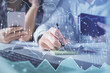 © peshkova - Double exposure of man and woman working together and financial graph hologram. Business concept. Computer background.