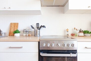 Scandinavian classic minimalistic kitchen with white and wooden details. Modern white kitchen clean contemporary style interior design.