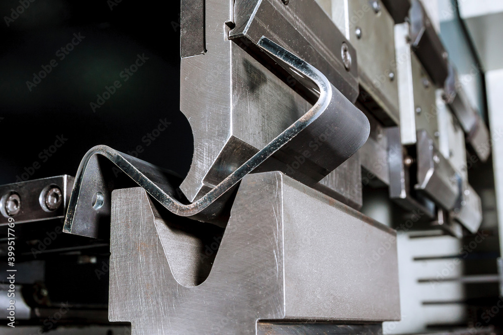 The process of bending sheet metal on a hydraulic bending machine - obrazy, fototapety, plakaty 