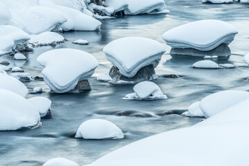 Hokkaido: snow pillows on rocks in stream