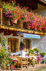 Canvas Print - typical bavarian frontyard at a farmhouse near the alps