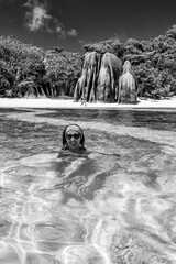 Wall Mural - Happy woman in the water, tropical destination. Holiday and travel concept