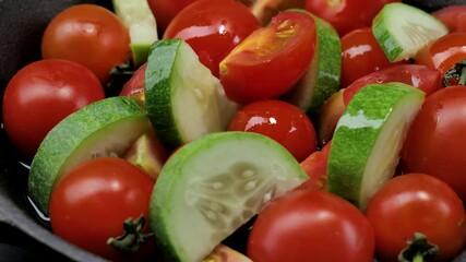 Wall Mural - Salad with tomatoes, olives oil, and cucumber on an iron plate, Fresh organic salad, Raw snack vegetable with olives oil as antipasti, Vegetable salad with cherry tomatoes on a dark background.