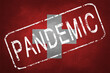 © Alex Puhovoy - The stamp 'PANDEMIC' against the background of the flag of Switzerland. Quarantine during the COVID-19 coronavirus pandemic in Switzerland. Anti-epidemic quarantine measures.