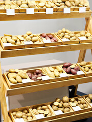 Wall Mural - Potatoes in wooden boxes in store