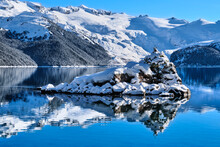 Mountain Lake Little Island Snow Winter Reflections.  Garibaldi Lake. Whistler. British Columbia. Canada 