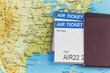 © Noey smiley - Air Ticket and passports on the map, flight to america, travel concept