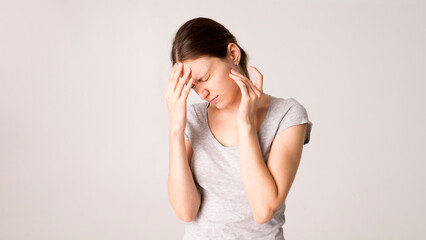 Canvas Print - Young beautiful woman has headache