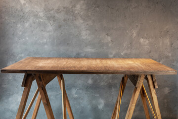 Poster - wooden table near concrete wall background