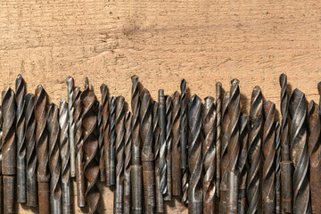 Wall Mural - old vintage hand tools - set of drills on a wooden background with blank space for text