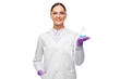 © Syda Productions - science, chemistry and people concept - happy smiling young female scientist in goggles with chemical in flask making test or research