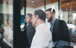 © BullRun - Serious diverse coworkers brainstorming in office
