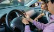 Two young men in a driving session. The instructor is teaching the young man to drive Learning to drive. Close up of Two young men in a driving session