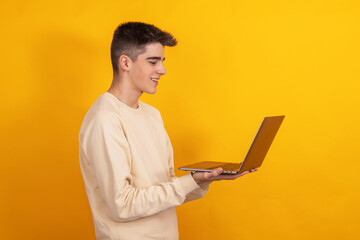 Poster - young student or teenager with laptop isolated on background