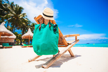 Wall Mural - White lounge chairs on a beautiful tropical beach