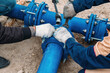 © Mulderphoto - Workers installing water supply pipeline system, close up