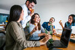 © Marcos - Mexican people coworkers eating pizza and drinking beer in office at Mexico city Happy Hour