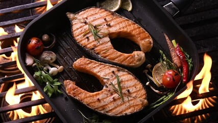 Wall Mural - Grilled salmon on pan on the flaming grill