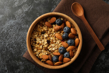 Napkin with bowl of granola on black smokey table