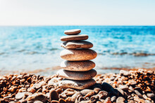 Balancing Stones On The Beach - Oriental Medicine - A Symbol Of Delicate Balance