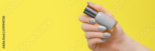 Leinwand Poster Female hand with gray nail design