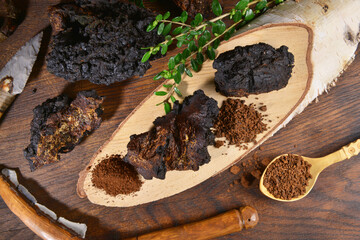 Wall Mural - Chaga Mushroom on a wooden Table - Healthy Nutrition