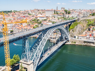 Canvas Print - PORTO, PORTUGAL - JUNE 11, 2019: Luis I bridge and Douro river. It is the second-largest city in Portugal. It was proclaimed a World Heritage Site by UNESCO in 1996.